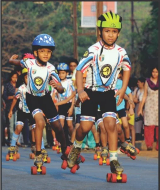 Rishikul pupils racing on the school skating rink in helmets and team kit